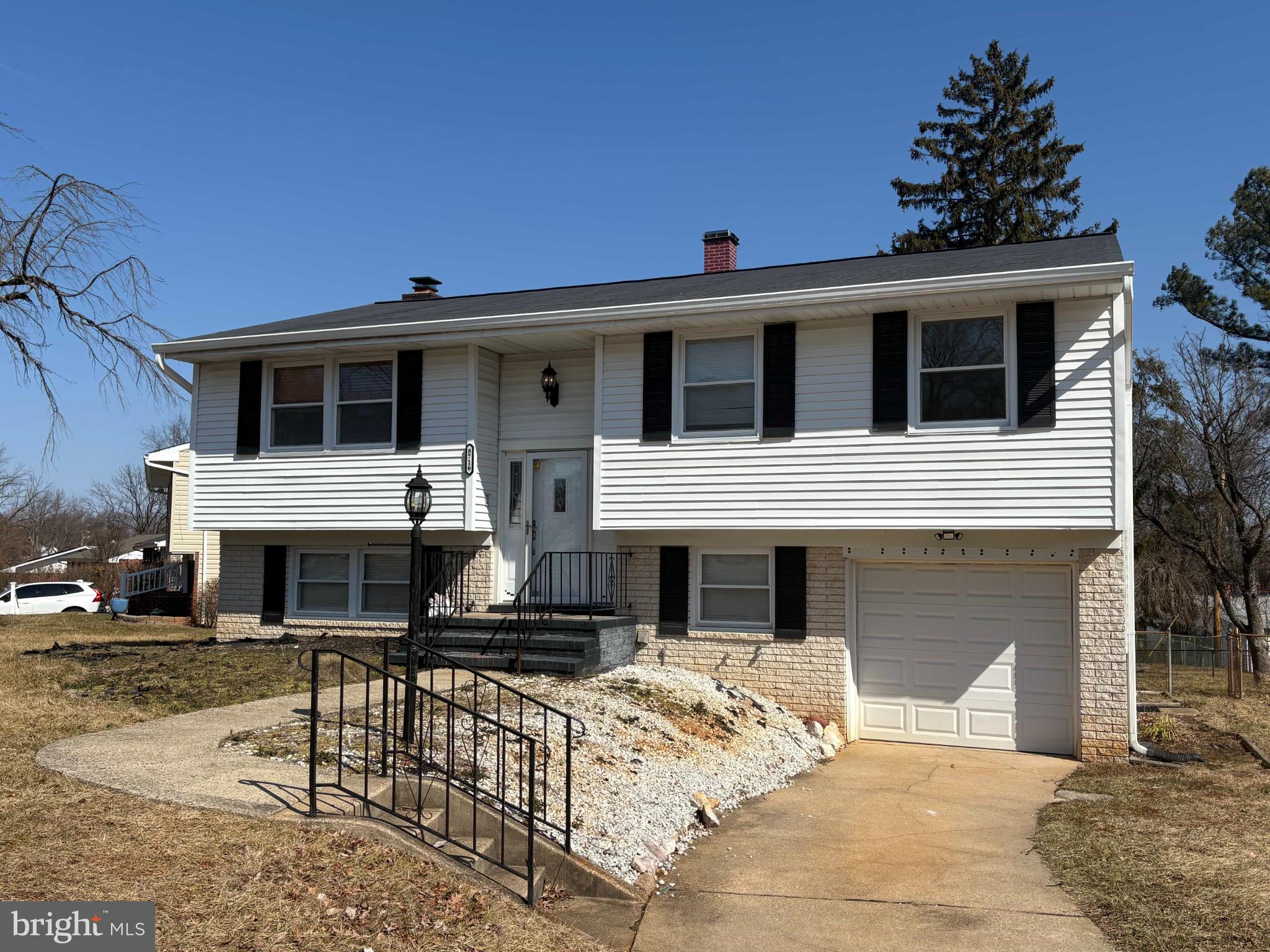 Charming split-level home with inviting curb ap...