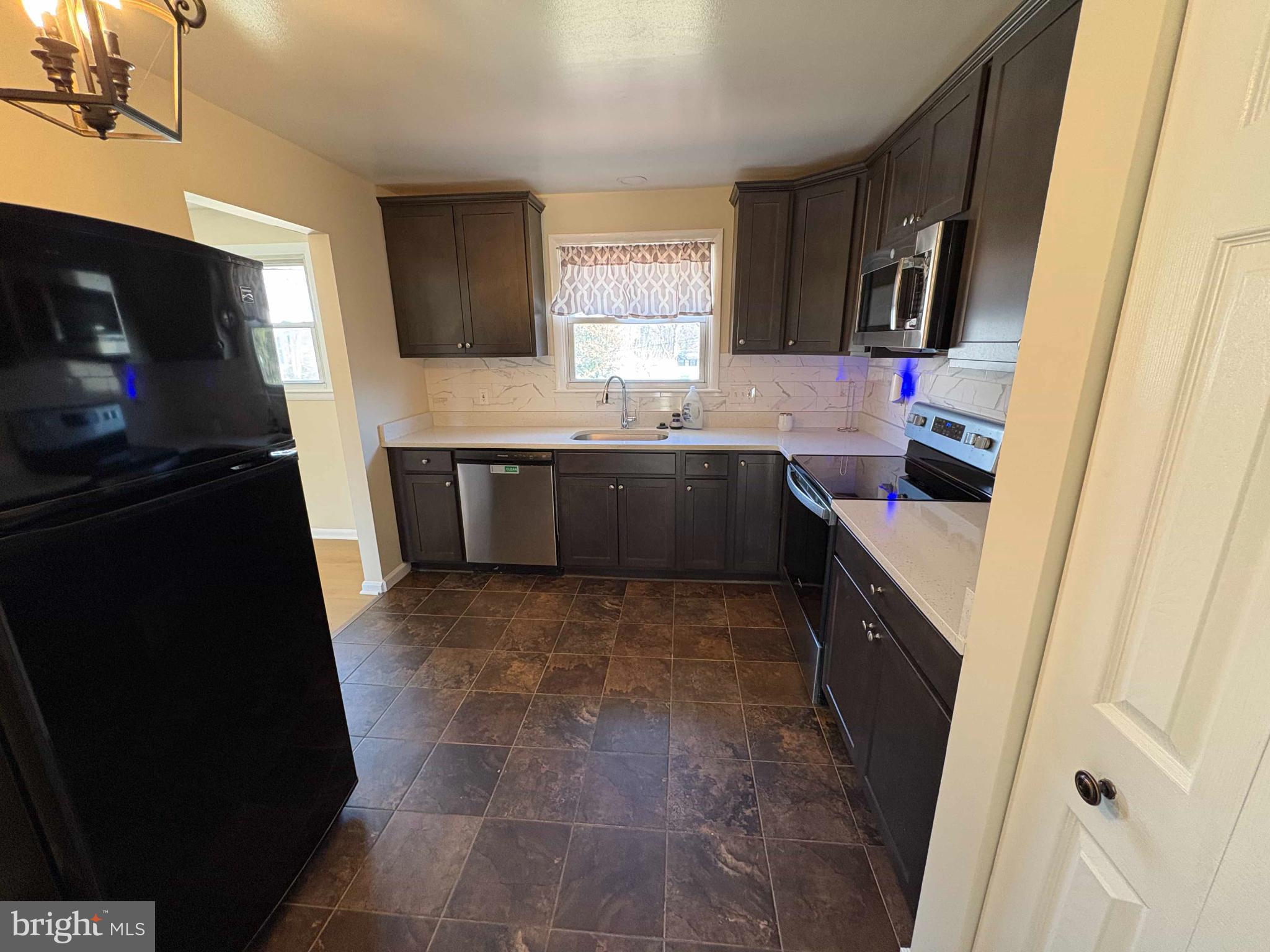 8716 Stephanie Road Randallstown, MD 21133 - Photo 17 of 19 Modern kitchen with sleek cabinetry.