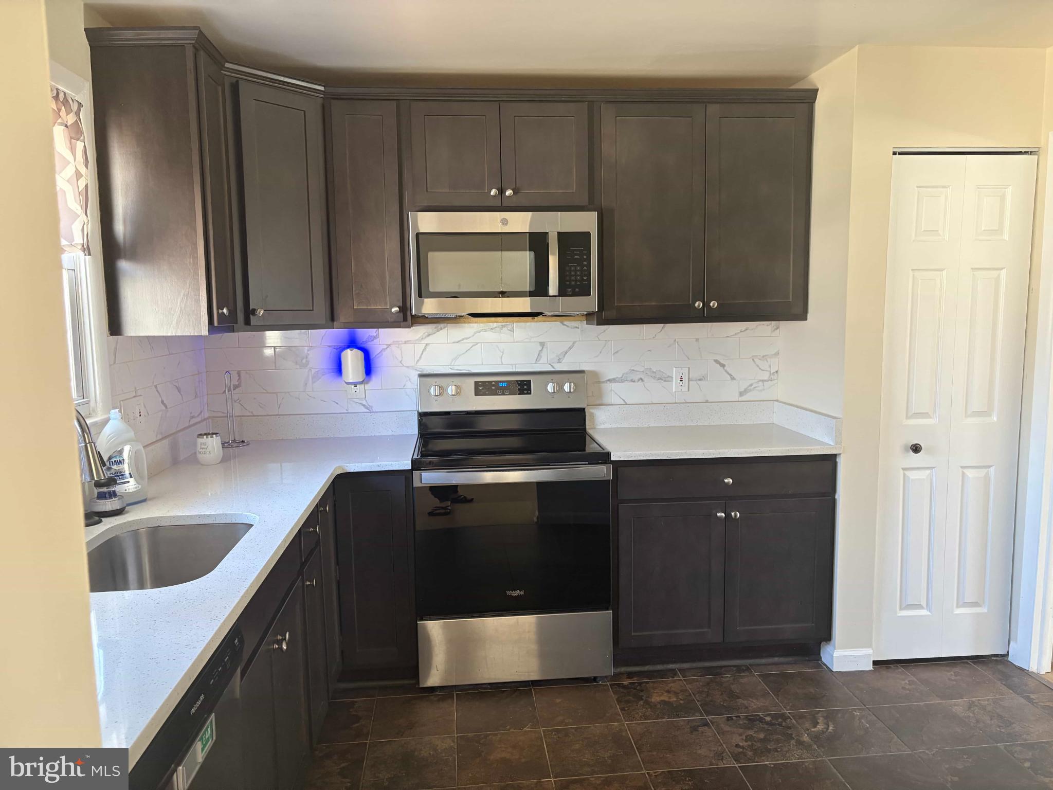 8716 Stephanie Road Randallstown, MD 21133 - Photo 2 of 19 Modern kitchen with sleek cabinetry.