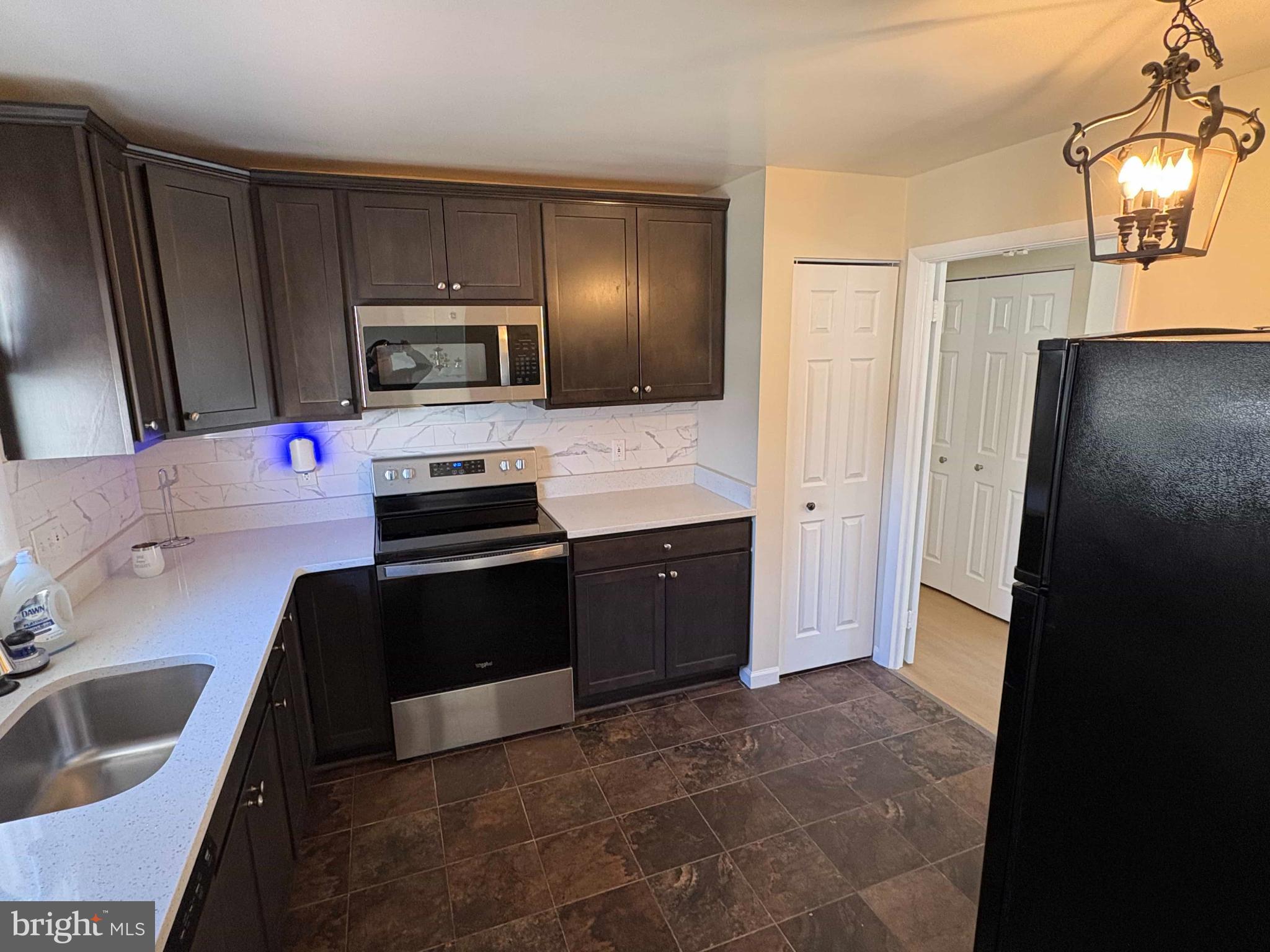 8716 Stephanie Road Randallstown, MD 21133 - Photo 4 of 19 Modern kitchen with sleek cabinetry.