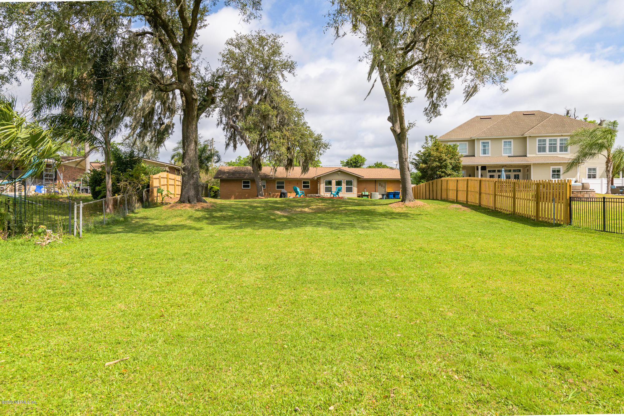 256 Baisden Road Jacksonville, FL 32218 - Photo 21 of 26 a view of swimming pool with outdoor seating and trees