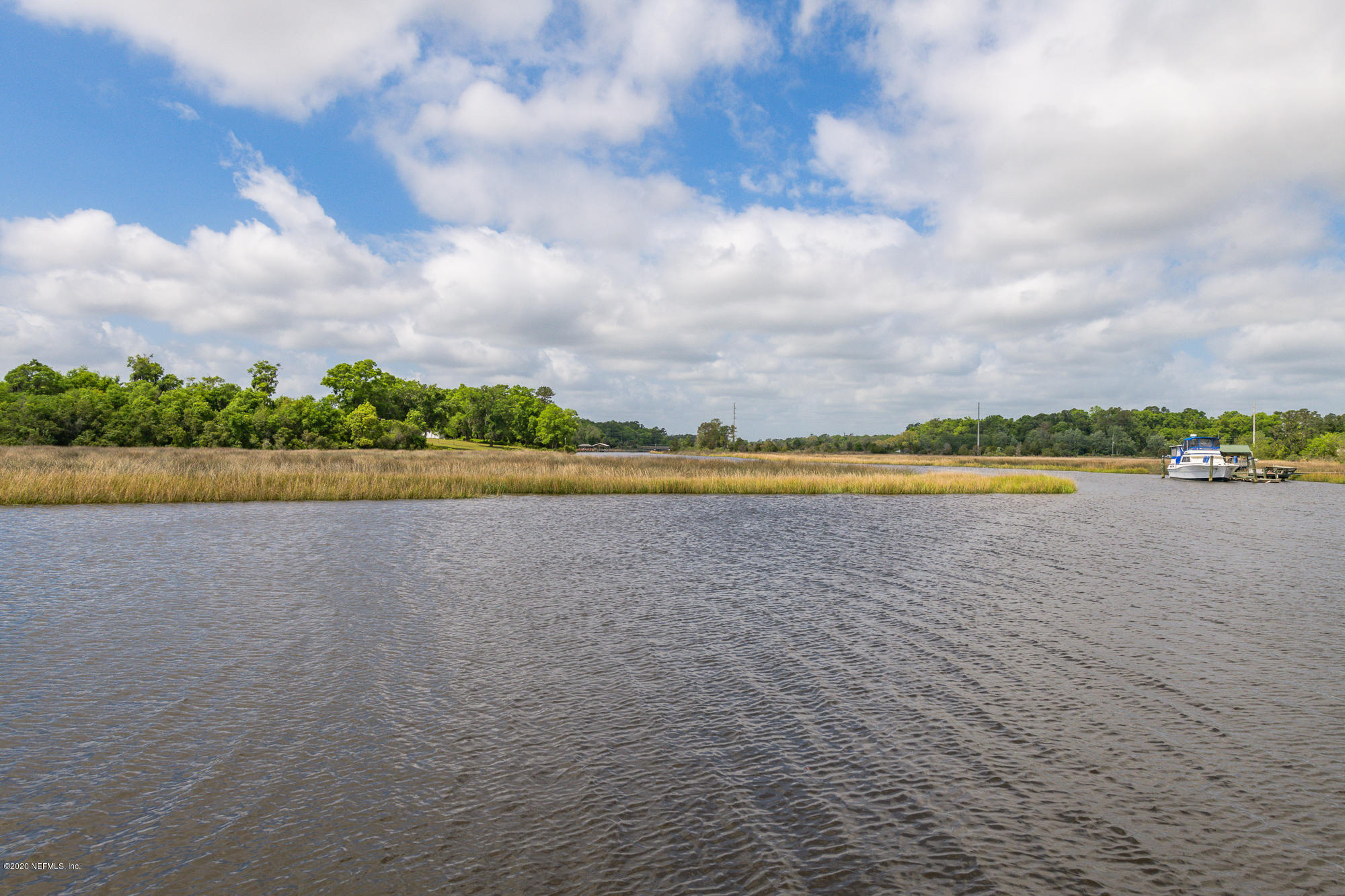 256 Baisden Road Jacksonville, FL 32218 - Photo 24 of 26 a view of a lake with houses in the background
