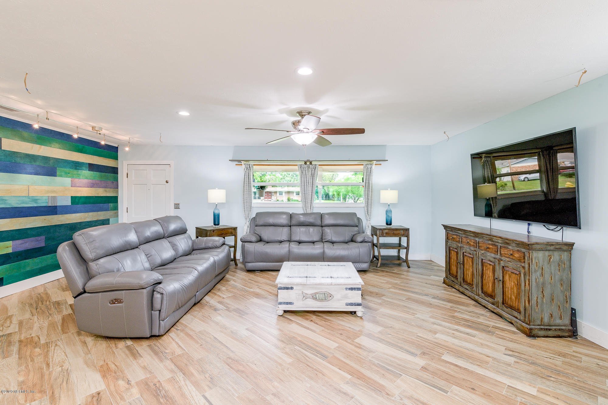 256 Baisden Road Jacksonville, FL 32218 - Photo 3 of 26 a living room with furniture and a flat screen tv