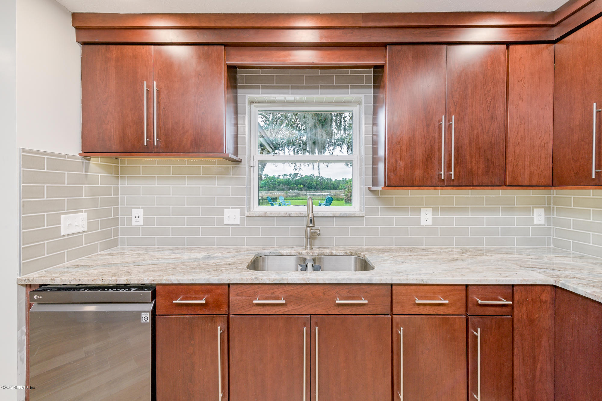 256 Baisden Road Jacksonville, FL 32218 - Photo 5 of 26 a kitchen with stainless steel appliances granite countertop a sink and a cabinets