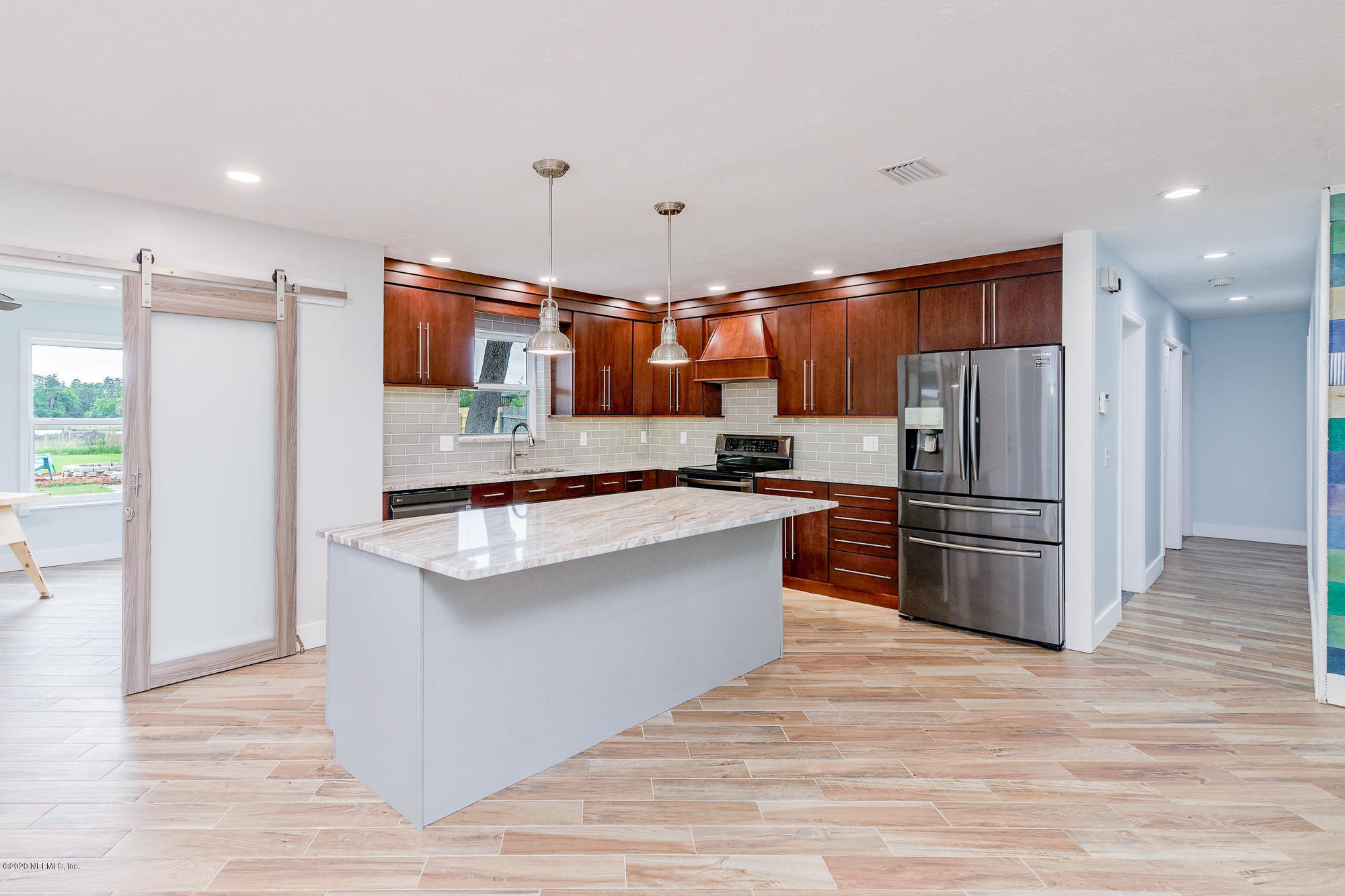 256 Baisden Road Jacksonville, FL 32218 - Photo 7 of 26 a kitchen with stainless steel appliances a refrigerator and a stove top oven