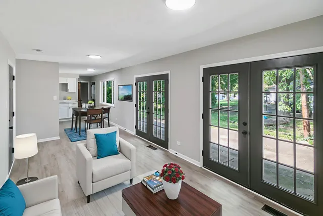 a living room with furniture and a large window