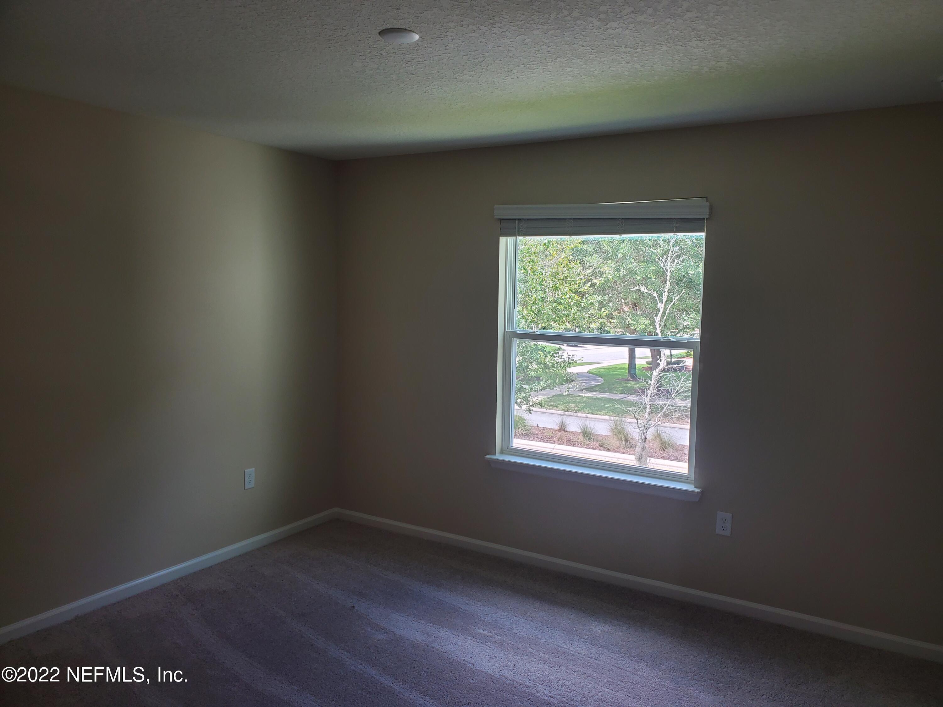 11792 Junegrass Road Jacksonville, FL 32258 - Photo 11 of 16 an empty room with a window