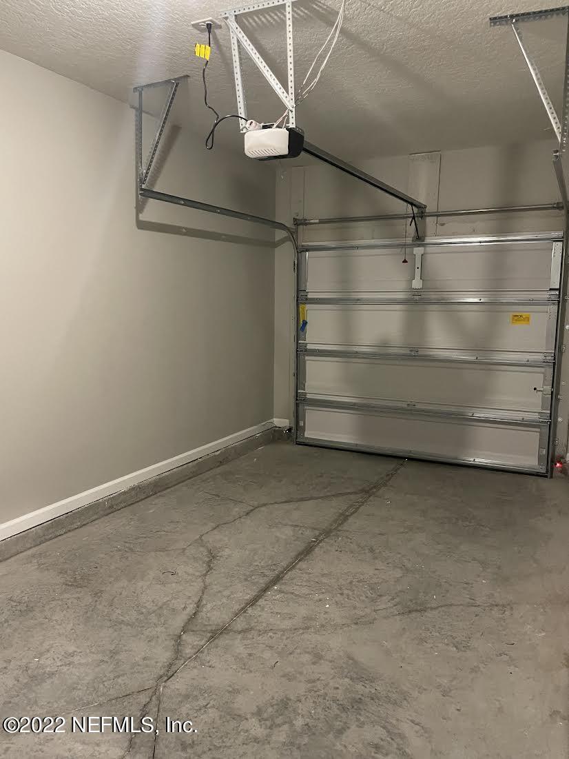 11792 Junegrass Road Jacksonville, FL 32258 - Photo 14 of 16 a view of a room with racks on the wall