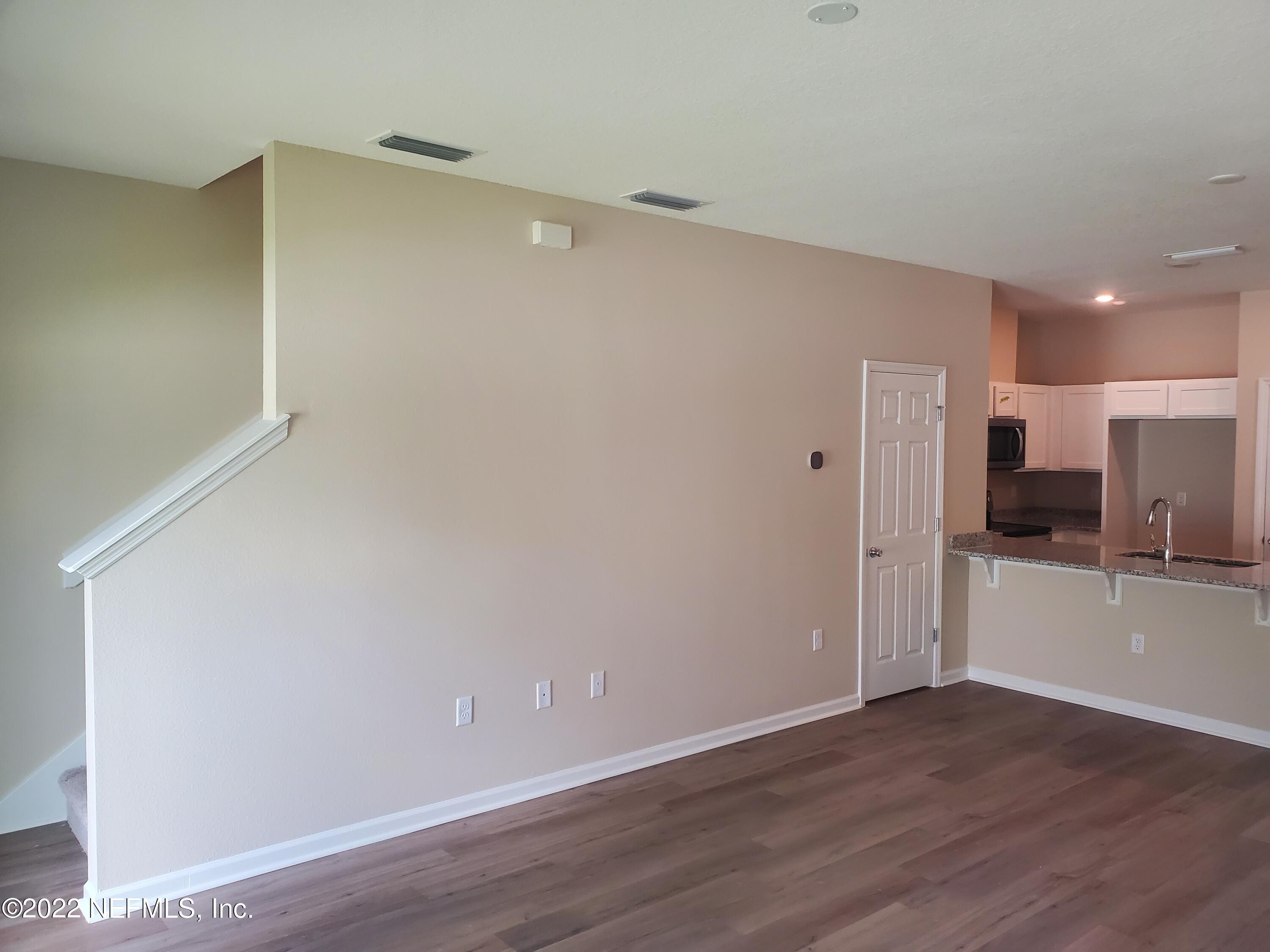 11792 Junegrass Road Jacksonville, FL 32258 - Photo 5 of 16 a view of a kitchen with a sink and a refrigerator