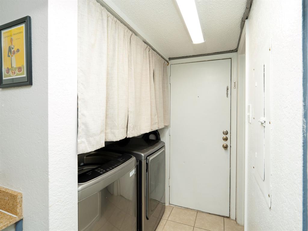 18240 Midway Road, Unit 205 Dallas, TX 75287 - Photo 10 of 27 a utility room with dryer and washer
