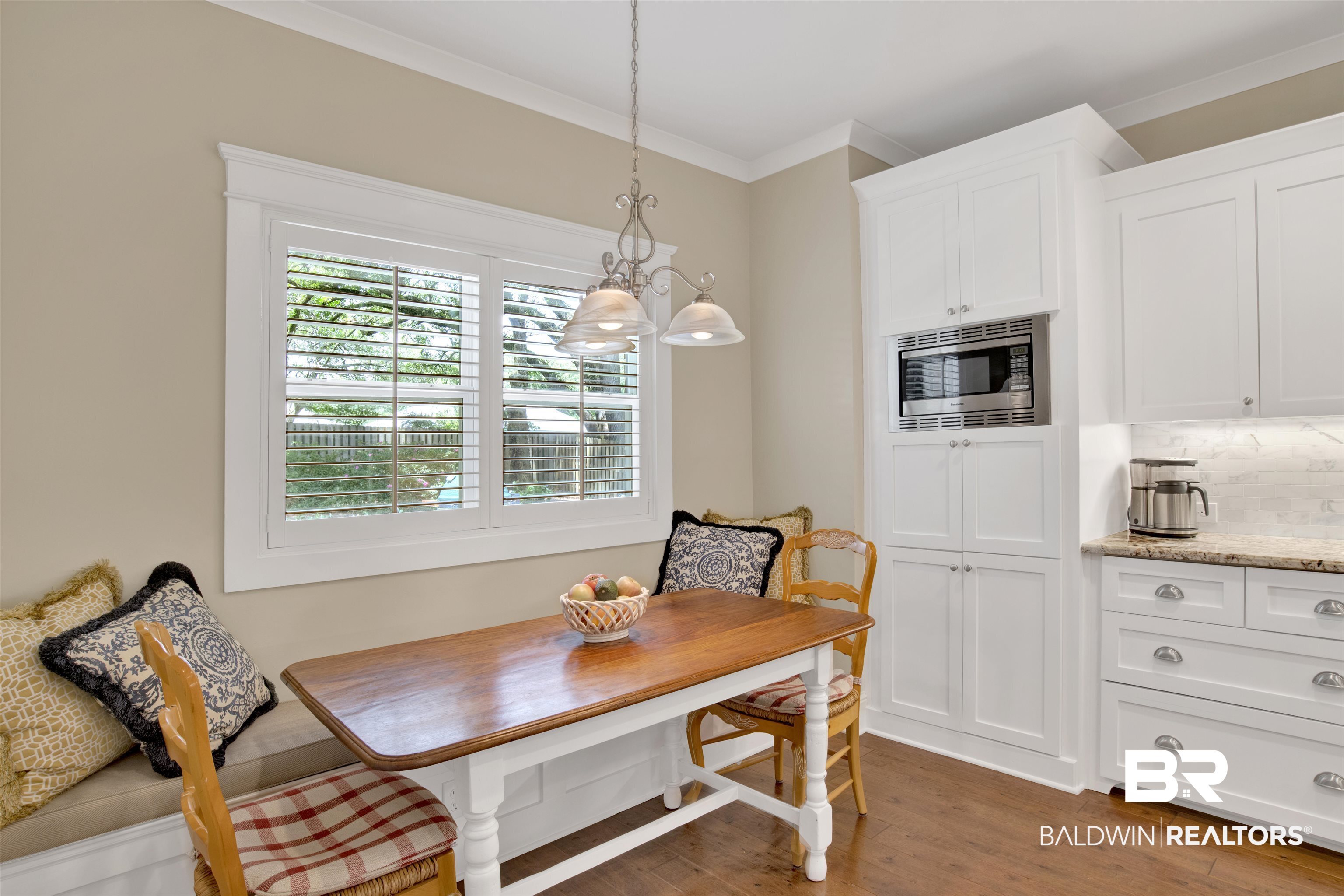 131 Sedgefield Avenue Fairhope, AL 36532 - Photo 19 of 50 Dining area with a chandelier, dark hardwood / wood-style flooring, and ornamental molding