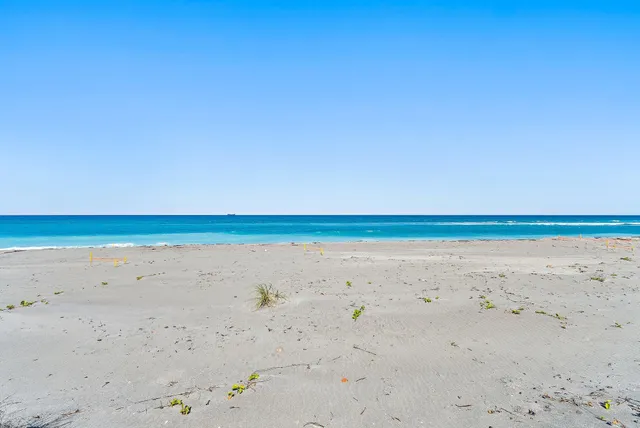 a dining room with furniture and a chandelier