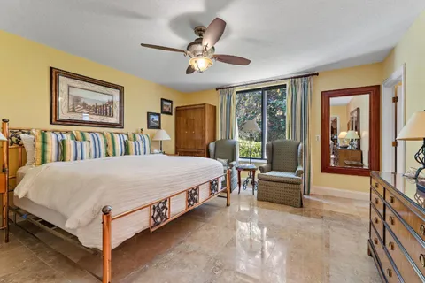 a kitchen with stainless steel appliances granite countertop a kitchen island a stove a table and chairs in it