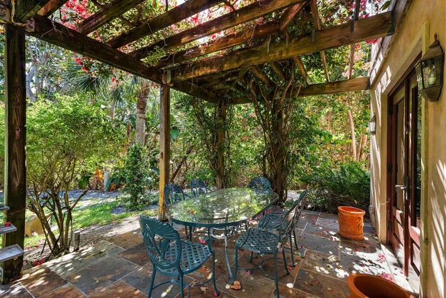 a front view of a house with a yard and tree s