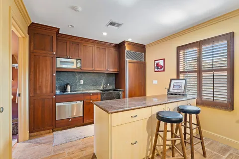 an outdoor space with furniture and umbrella