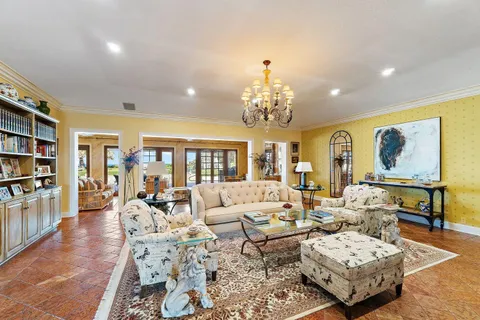 a kitchen with a table chairs refrigerator and cabinets