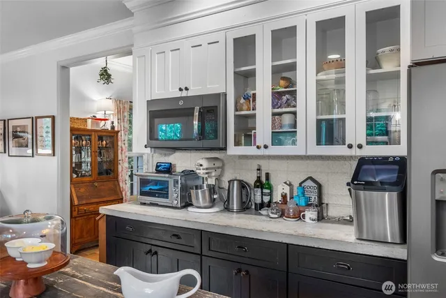 a kitchen with stainless steel appliances granite countertop a sink and cabinets