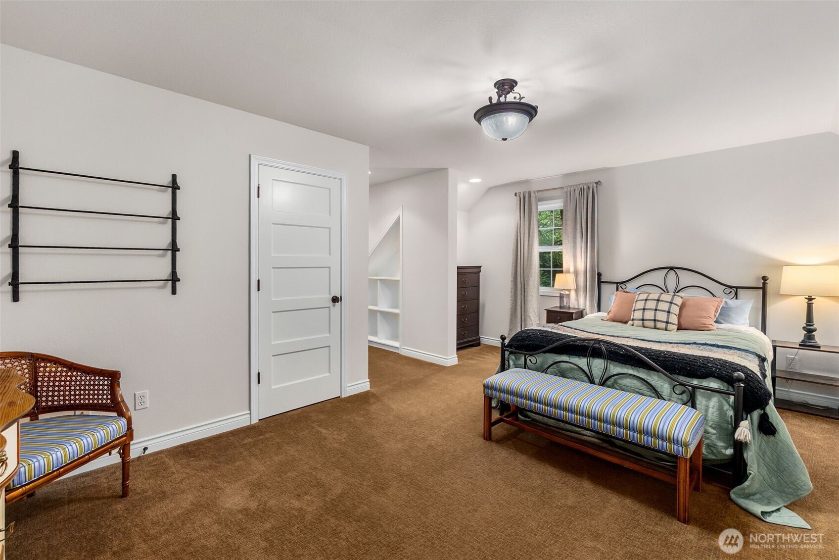1130 East Sunset Hill Road Shelton, WA 98584 - Photo 28 of 40 a view of a bedroom with furniture and a ceiling fan