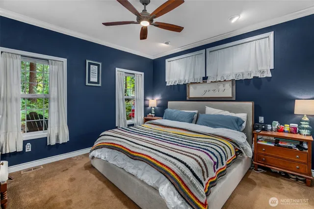 a bedroom with bed and window