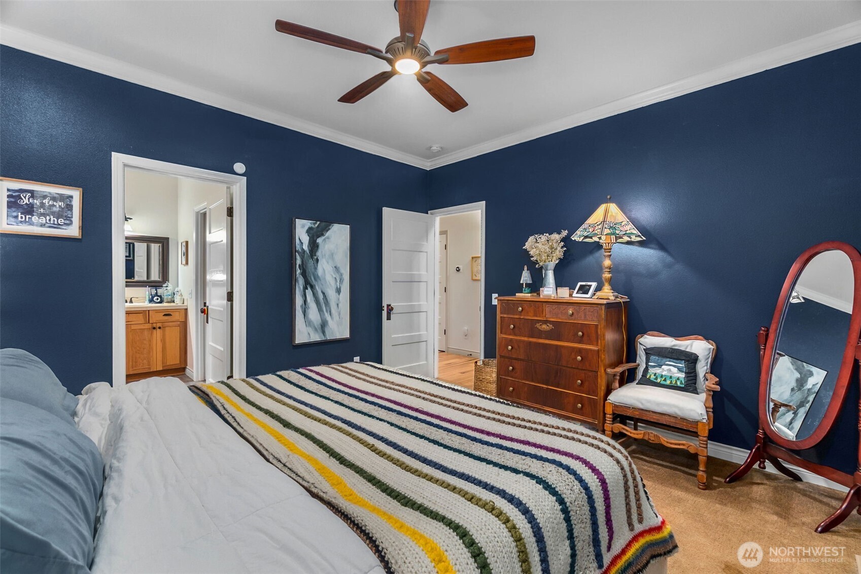 1130 East Sunset Hill Road Shelton, WA 98584 - Photo 5 of 40 a bedroom with a bed and wooden floor