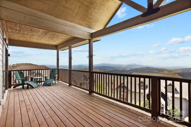 a view of balcony with wooden floor