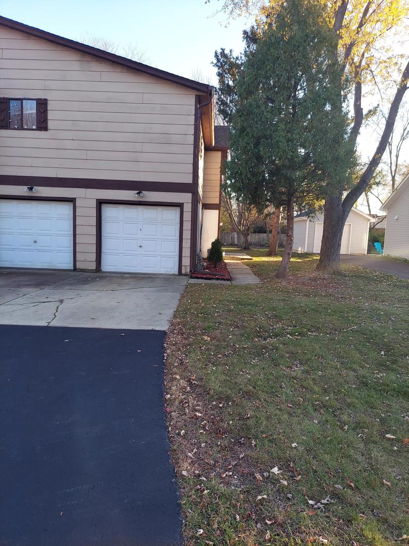 34W951 Stanton Drive, Unit G St. Charles, IL 60174 - Photo 1 of 11 a front view of a house with yard
