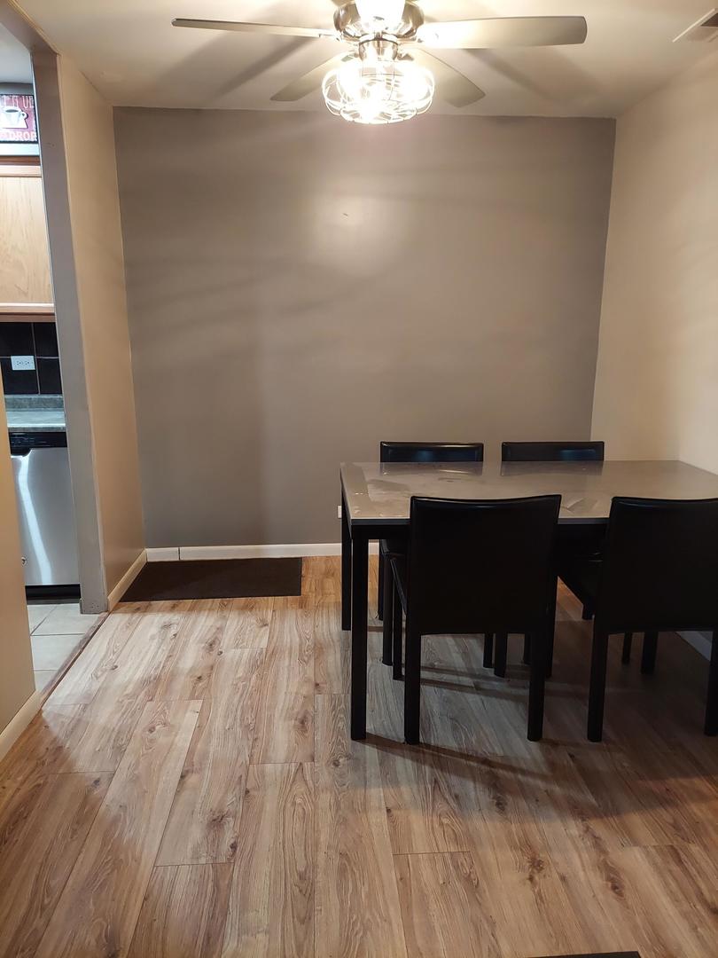 34W951 Stanton Drive, Unit G St. Charles, IL 60174 - Photo 7 of 11 a view of a room with wooden floor and windows