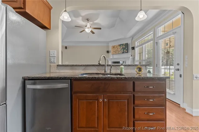 a bathroom with a granite countertop double vanity sink and mirror