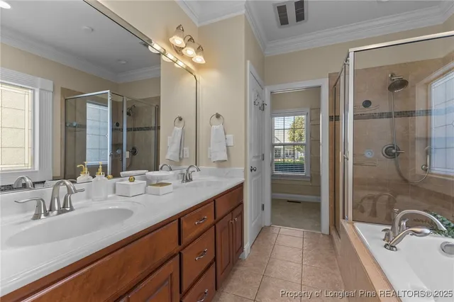 a view of a living room with hardwood floor and windows