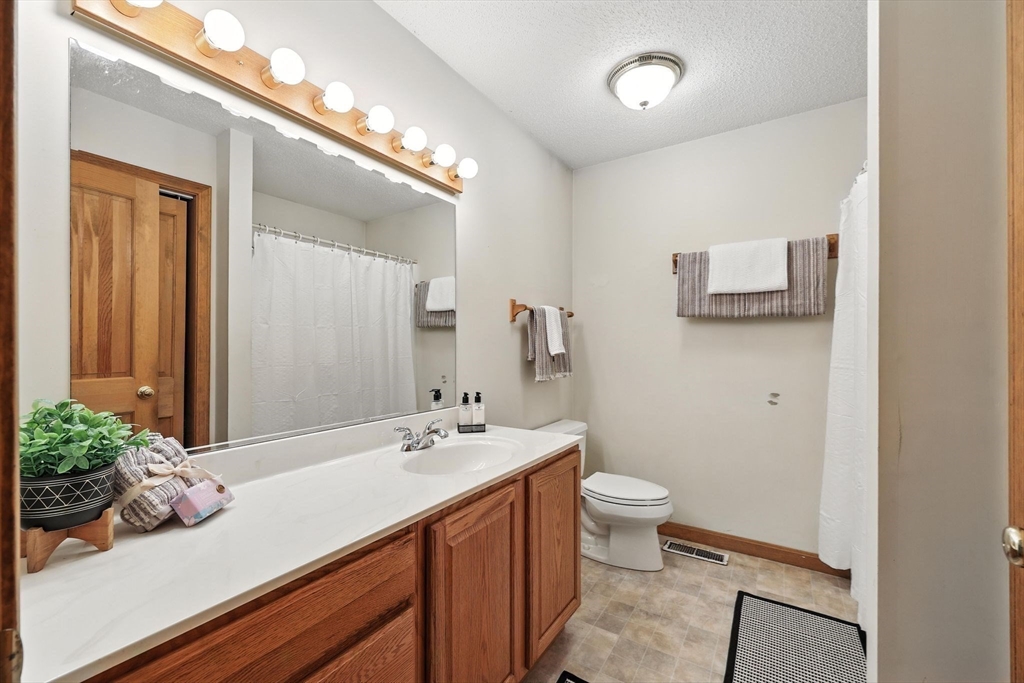 285 Lower Hampden Road Monson, MA 01057 - Photo 24 of 40 a bathroom with a sink a toilet and mirror