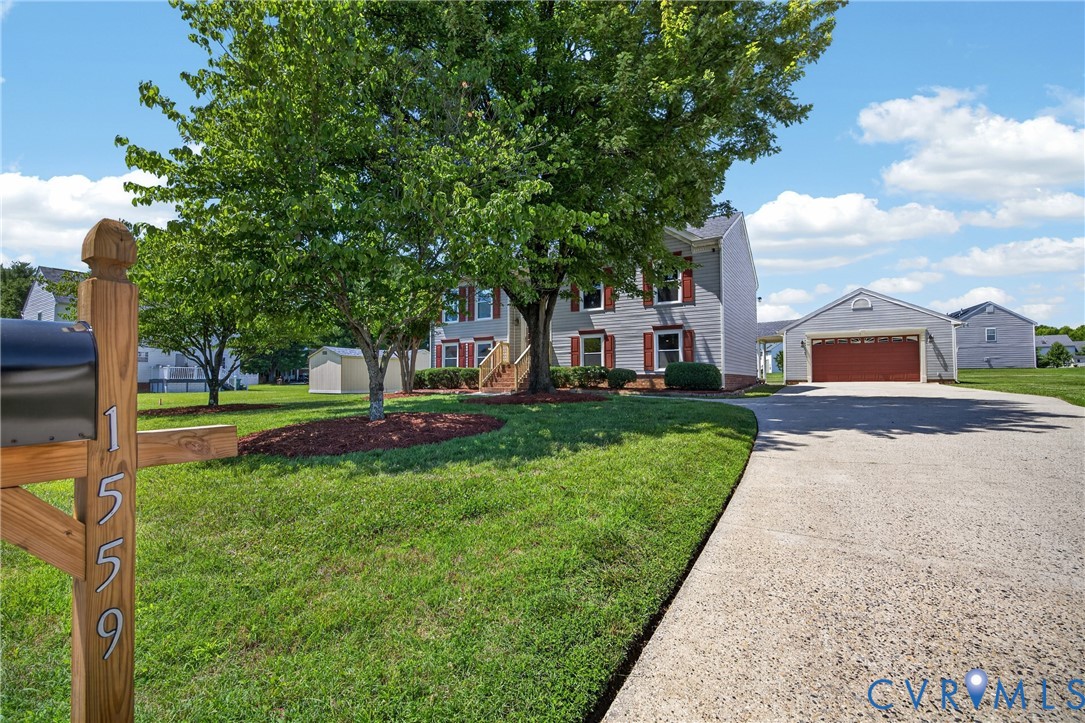 1559 Tree Ridge Road Henrico, VA 23231 - Photo 3 of 40 Gray siding residence featuring red window shutter