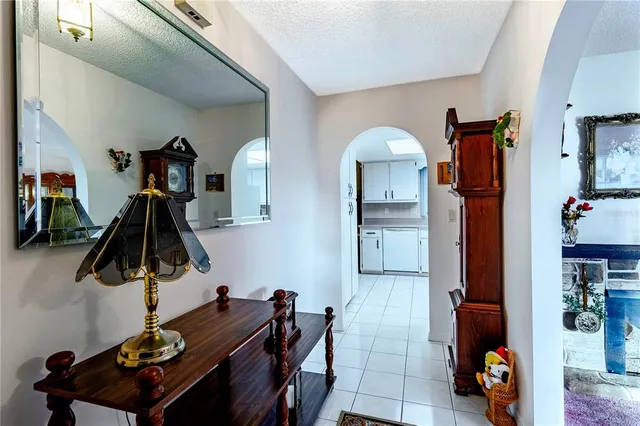 a kitchen with stainless steel appliances kitchen island a stove and a refrigerator