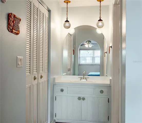 a bathroom with a sink and a mirror