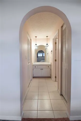 a view of a hallway with a washer and dryer