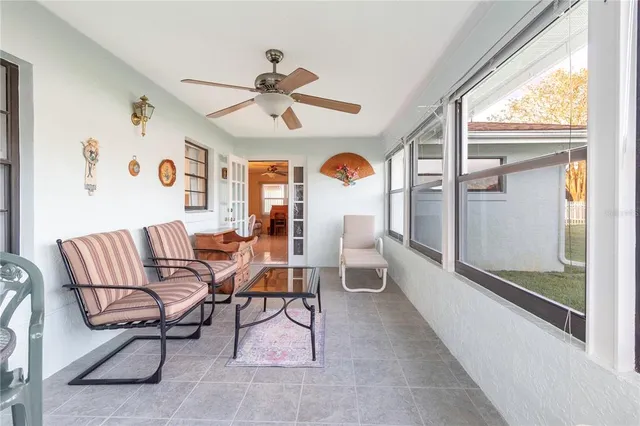 a view of a livingroom with furniture and a window
