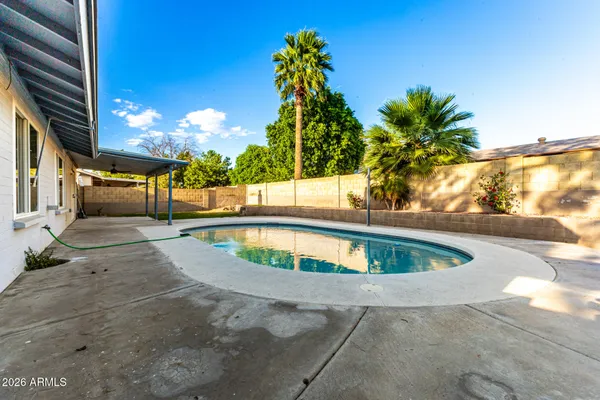 a view of outdoor space and swimming pool