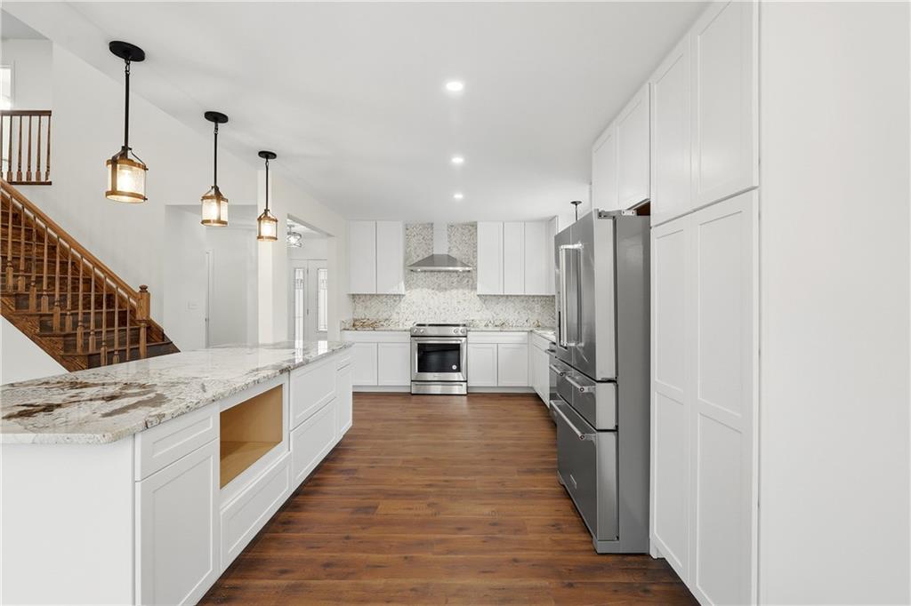 5149 Watters Road Lower Burrell, PA 15068 - Photo 13 of 49 a large kitchen with a large counter top appliances and cabinets