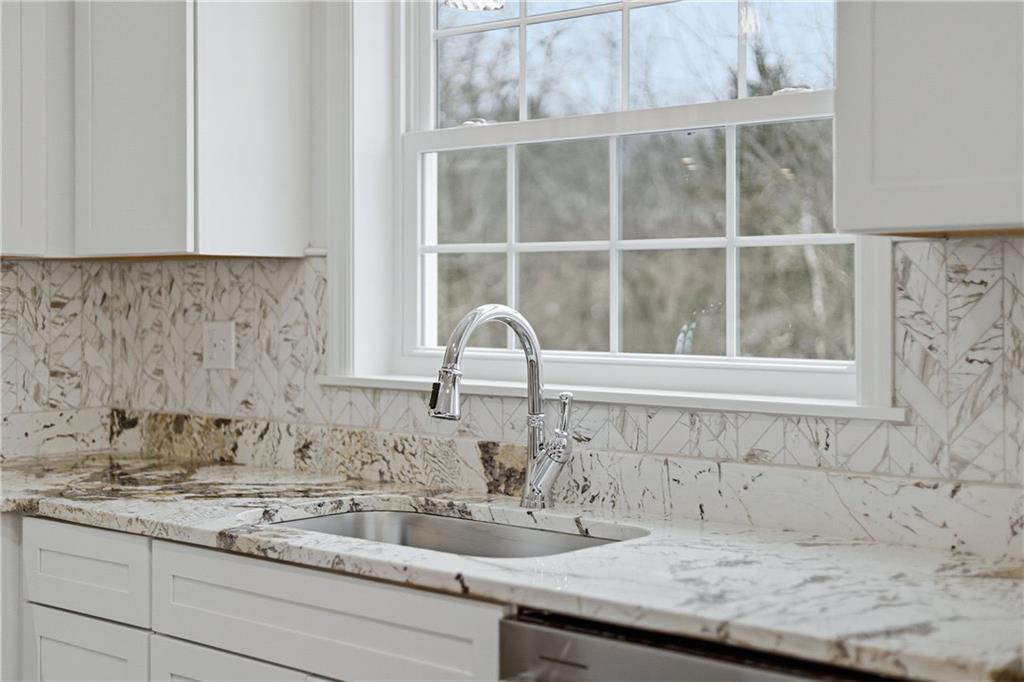 5149 Watters Road Lower Burrell, PA 15068 - Photo 14 of 49 a bathroom with a granite countertop sink and a window