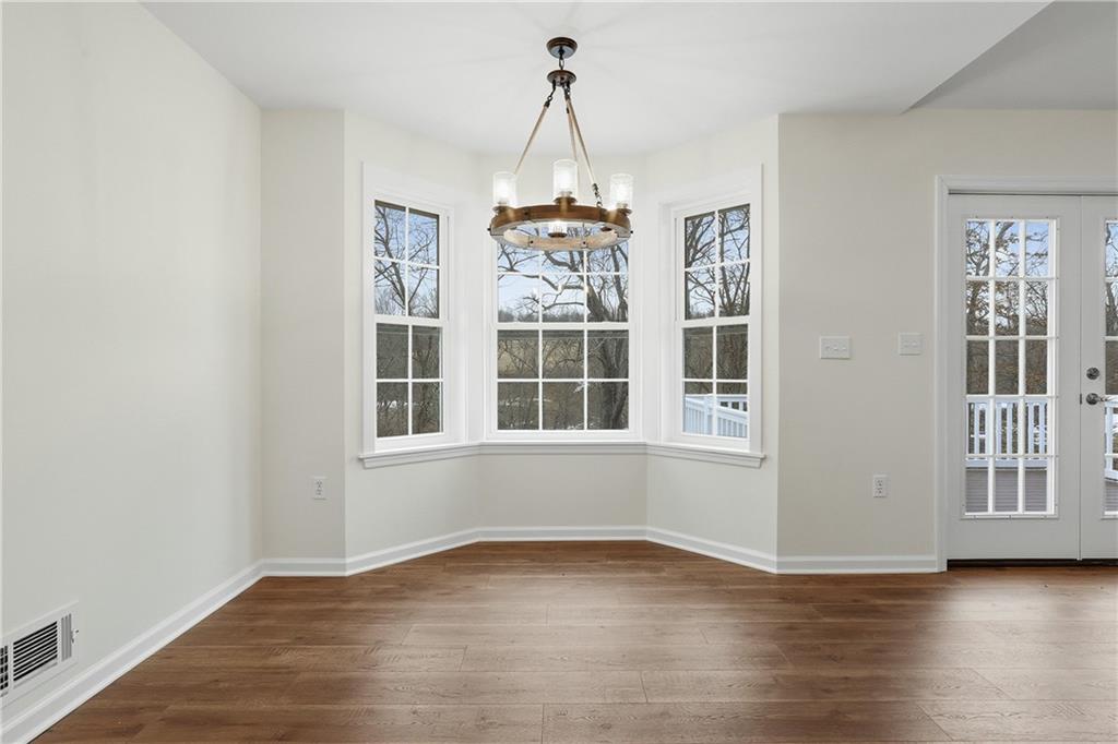 5149 Watters Road Lower Burrell, PA 15068 - Photo 15 of 49 a view of an empty room with wooden floor and a window