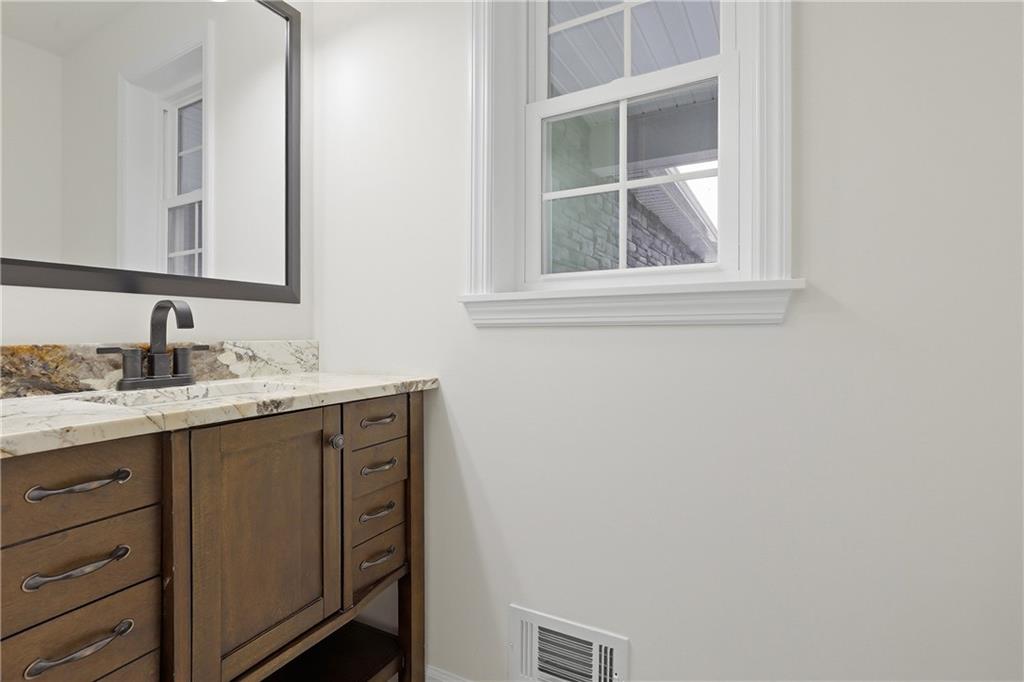 5149 Watters Road Lower Burrell, PA 15068 - Photo 20 of 49 a bathroom with a granite countertop sink and a mirror