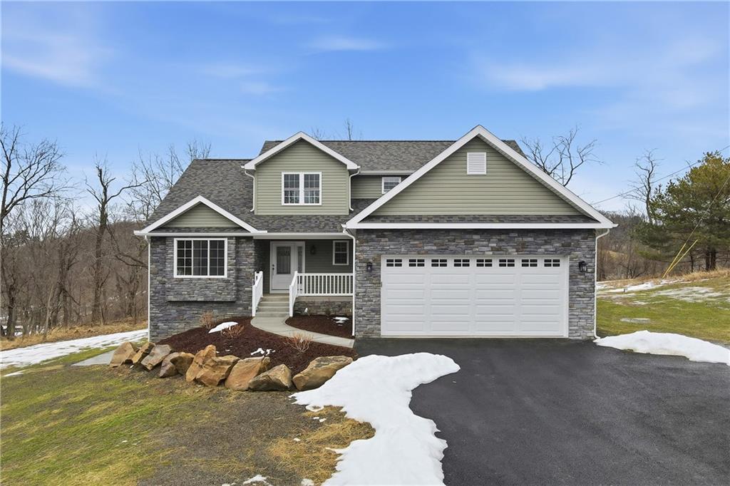 5149 Watters Road Lower Burrell, PA 15068 - Photo 2 of 49 a front view of a house with a yard and garage