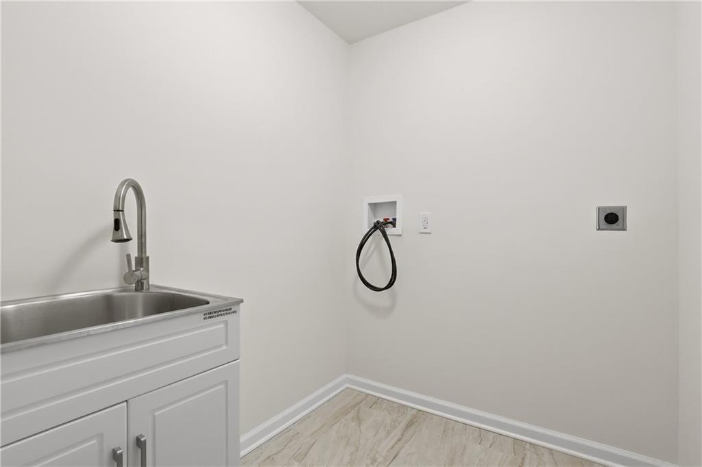 5149 Watters Road Lower Burrell, PA 15068 - Photo 21 of 49 a bathroom with a sink and dryer