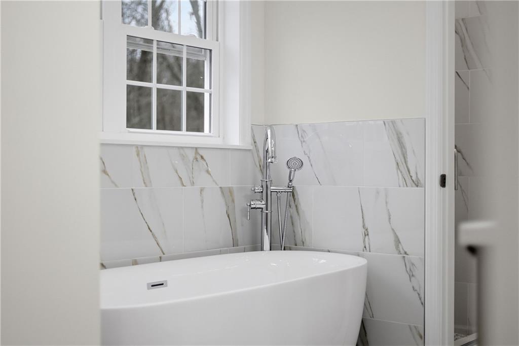 5149 Watters Road Lower Burrell, PA 15068 - Photo 25 of 49 a bathroom with a tub and a window