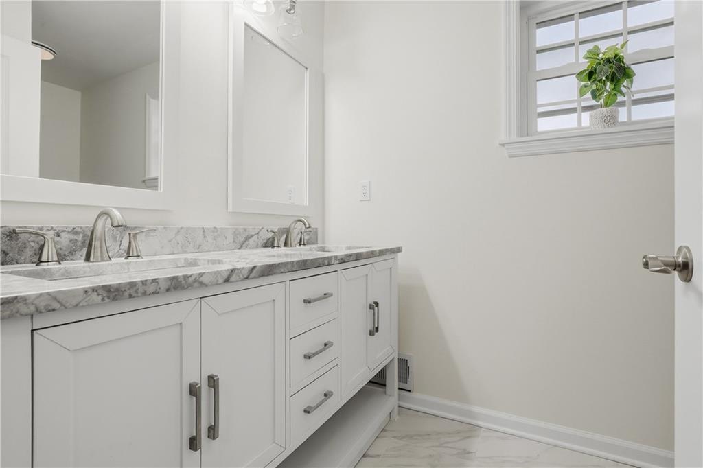 5149 Watters Road Lower Burrell, PA 15068 - Photo 31 of 49 a bathroom with a granite countertop sink and a mirror