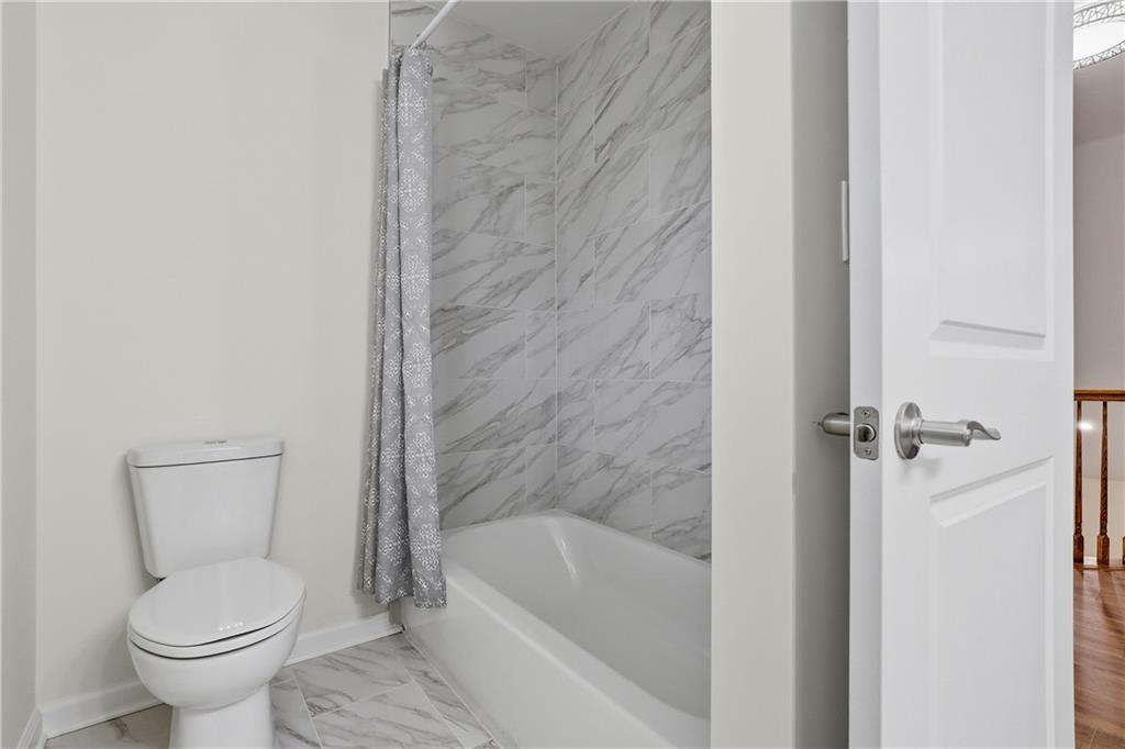 5149 Watters Road Lower Burrell, PA 15068 - Photo 32 of 49 a bathroom with a toilet and a bathtub