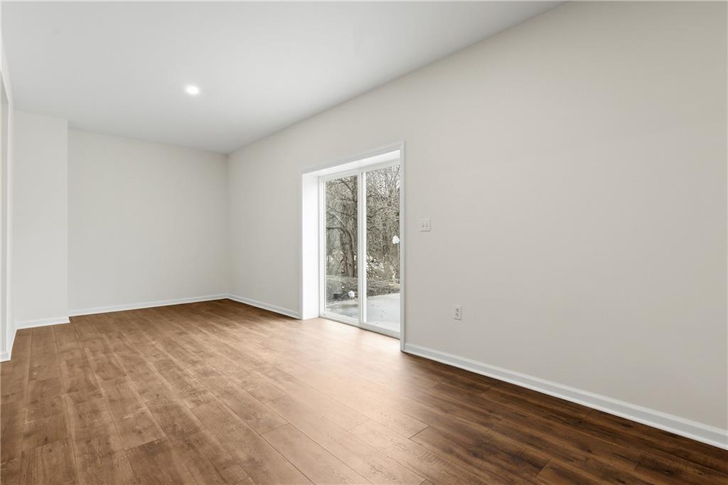 5149 Watters Road Lower Burrell, PA 15068 - Photo 38 of 49 an empty room with wooden floor and windows