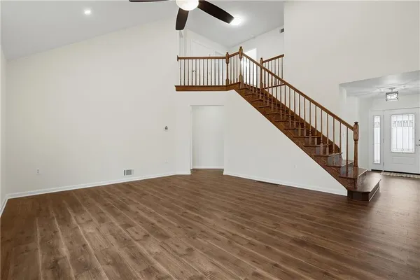 a view of room with wooden floor