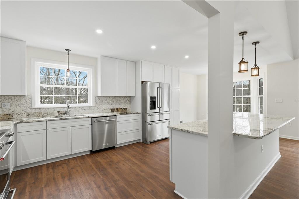 5149 Watters Road Lower Burrell, PA 15068 - Photo 9 of 49 a kitchen with a sink wooden floor and stainless steel appliances