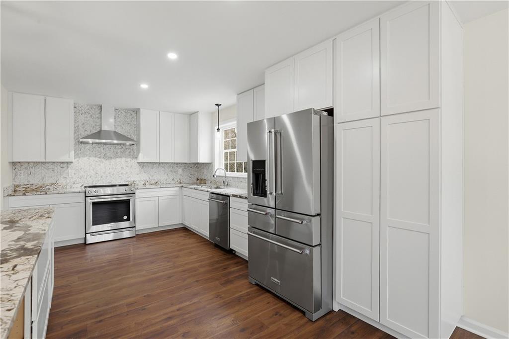 5149 Watters Road Lower Burrell, PA 15068 - Photo 10 of 49 a kitchen with a refrigerator cabinets and wooden floor