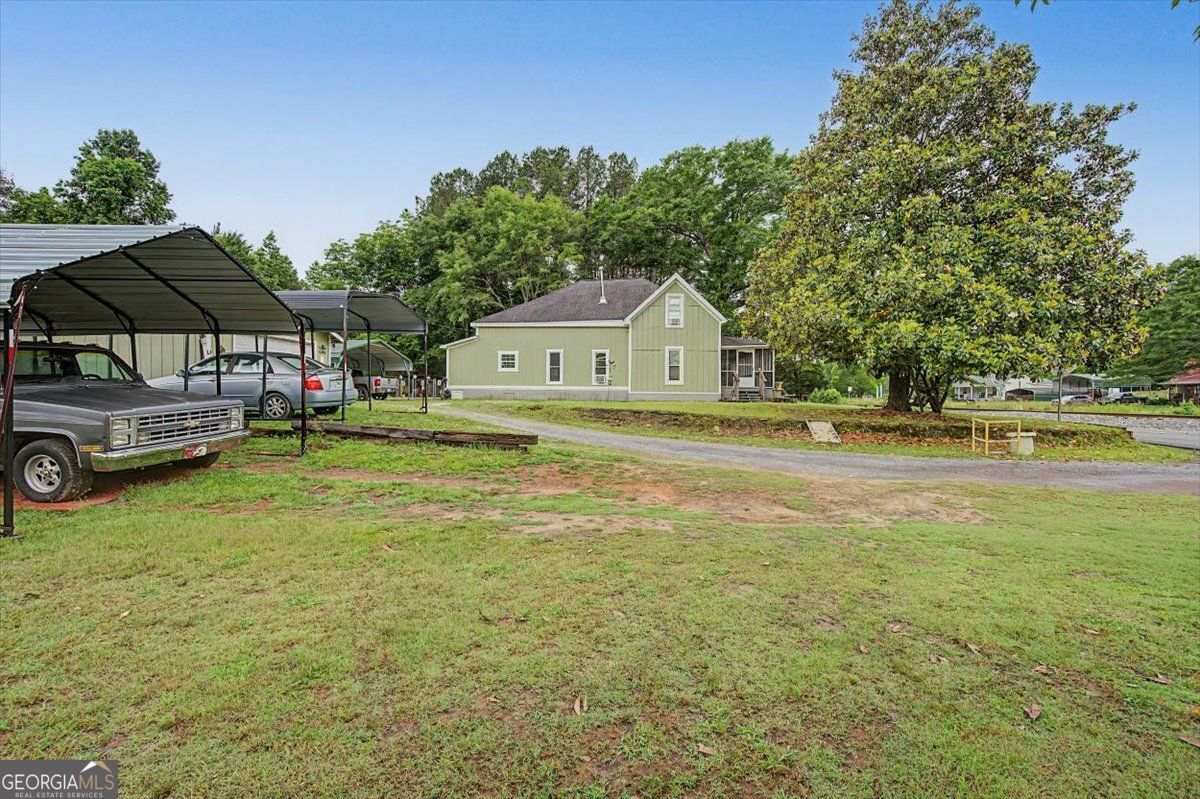 483 Coal Road Northwest Resaca, GA 30735 - Photo 44 of 56 a front view of a house with a garden and yard